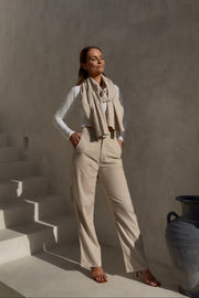 On-model full-length view of the undyed luxury trousers in a standing pose, showcasing their tailored high waist and elegant straight-leg silhouette.